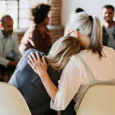 People support each other in a rehab session People support each other in a rehab session