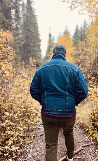 Back,Of,Man,In,Denim,Jacket,Walking,Through,Fall,Forest Back,Of,Man,In,Denim,Jacket,Walking,Through,Fall,Forest
