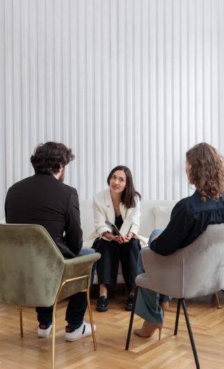 A,Female,Psychologist,Sitting,Opposite,Of,Family,Couple,With,A A,Female,Psychologist,Sitting,Opposite,Of,Family,Couple,With,A